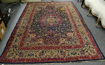 Lot 1291 - Tabriz carpet, Iranian Azerbaijan, the indigo field of vines around a flower head medallion...