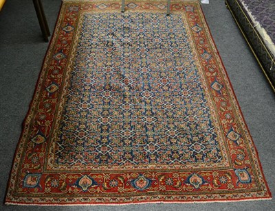 Lot 1292 - Kashan rug, Central Iran, circa 1940, the indigo Herati field enclosed by terracotta borders, 205cm