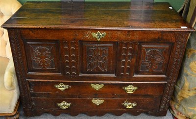 Lot 1299 - An 18th century oak mule chest, carved front bearing FA 1741