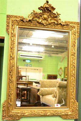 Lot 1300 - A gilt gesso wall mirror