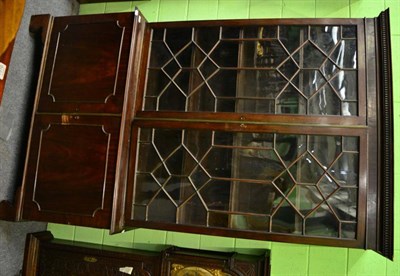 Lot 1306 - A 19th century mahogany bookcase, the bottom fitted with two cupboard doors