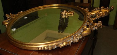 Lot 1320 - A reproduction gilt mirror