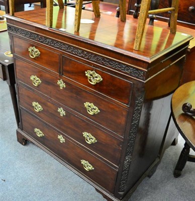 Lot 1334 - A mahogany four height chest of drawers, with blind fret carved decoration, on bracket feet