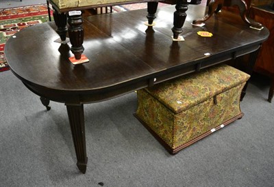 Lot 1344 - A mahogany wind out dining table with two leaves