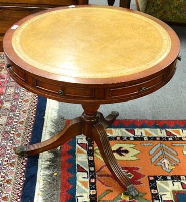 Lot 1349 - A reproduction Georgian drum top table with leather top