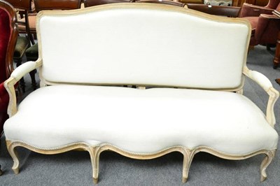 Lot 1361 - A 19th century French limewood three seater sofa