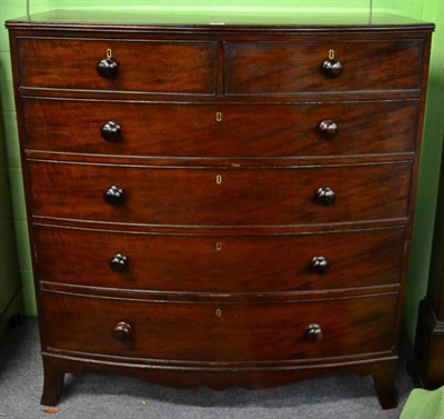 Lot 1372 - A mahogany bow front five height chest of drawers on bracket feet