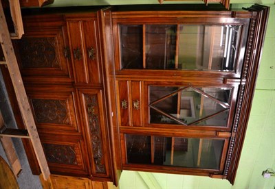 Lot 1378 - A late Victorian carved mahogany bookcase with bevelled glass panels