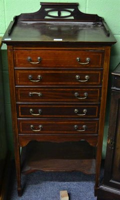 Lot 1380 - A mahogany inlaid music cabinet