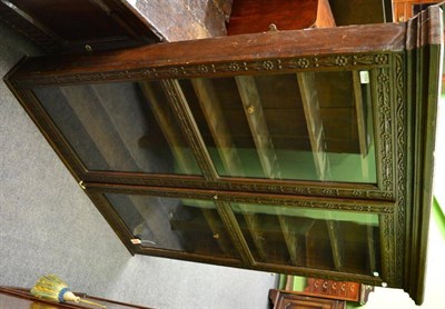 Lot 1394 - A carved oak glazed hanging cupboard of large proportions