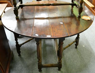 Lot 1396 - An 18th century oak gateleg table