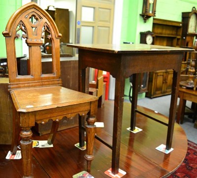 Lot 1400 - An oak single drawer occasional table, and a single Gothic style hall chair (2)