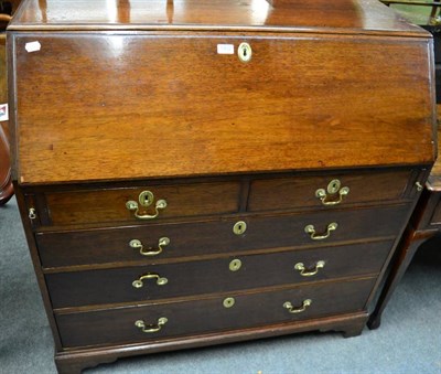 Lot 1402 - An early 19th century mahogany bureau