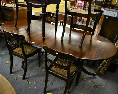 Lot 1414 - A Georgian style mahogany twin pedestal dining table