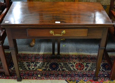 Lot 1421 - A 19th century mahogany fold over tea table