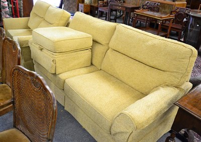 Lot 1424 - A three piece suite comprising a three seater sofa, a two seater sofa and a footstool