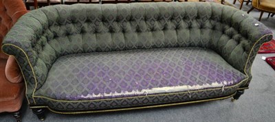 Lot 1432 - A Victorian ebonised and gilt metal mounted three seater sofa, upholstered in dark green and purple