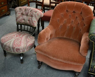 Lot 1433 - A Victorian button back armchair together with a Victorian ebonised and gilt decorated...