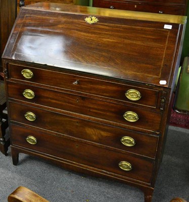 Lot 1440 - An early 19th century mahogany bureau