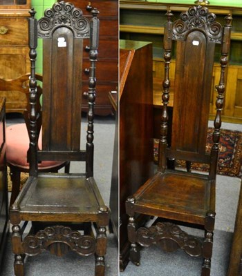 Lot 1441 - A pair of oak high backed chairs