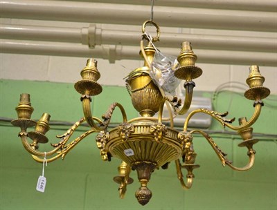 Lot 1446 - A bronze eight light chandelier