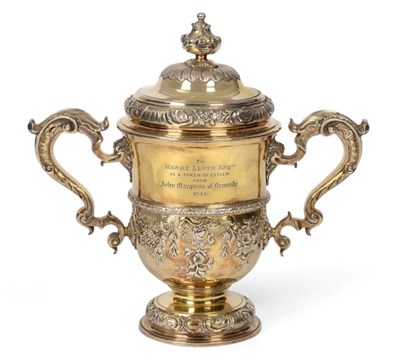 Lot 86 - A George II Silver Gilt Cup and Cover, Thomas Whipham, London 1742, with domed cover, C scroll...