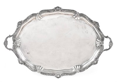 Lot 110 - A Large Victorian Silver Twin Handled Tray, Edward Hutton, London 1892, shaped oval with an...