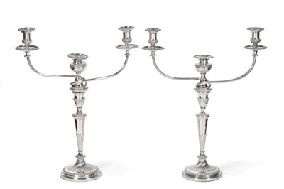 Lot 111 - A Pair of George III Silver Candlesticks, Nathaniel Smith & Co, Sheffield 1800, with urn shaped...