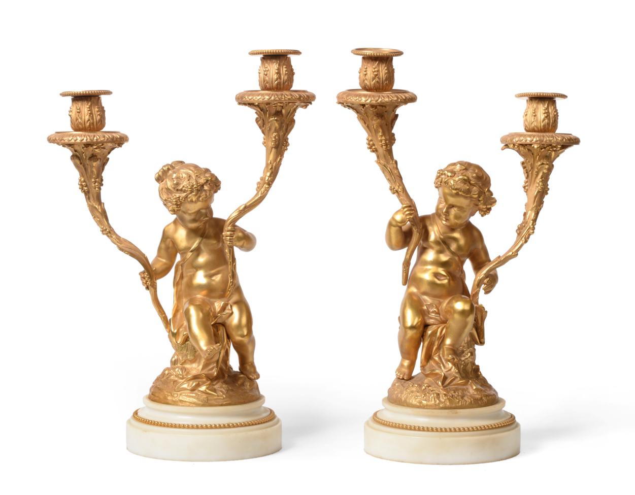 Lot 264 - A Pair of French Gilt Bronze Twin-Light Candelabra, in Louis XVI style in the manner of...