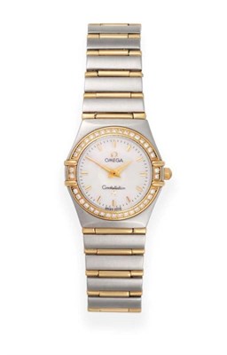 Lot 115 - A Lady's Steel and Gold Diamond Set Wristwatch, signed Omega, model: Constellation, circa 2010,...