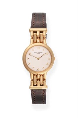 Lot 125 - A Lady's 18ct Gold Wristwatch, signed Patek Philippe, model: Calatrava, ref: 4812, circa 2000,...