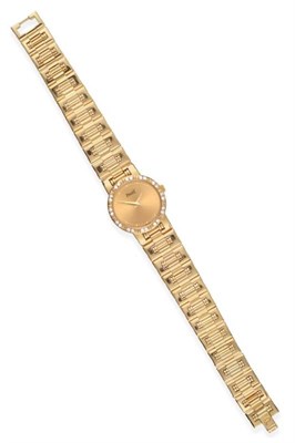 Lot 126 - A Lady's 18ct Gold Diamond Set Wristwatch, signed Piaget, model: Piaget Dancer, ref: 80563K81,...
