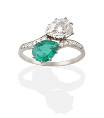 Lot 143 - An Early Twentieth Century Emerald and Diamond Crossover Ring, a pear cut emerald and an old...