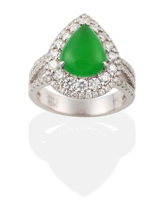 Lot 149 - A Jade and Diamond Cluster Ring, a pear cabochon jade in a claw setting, within a two tier...