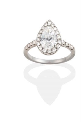 Lot 156 - A Pear Cut Diamond Cluster Ring, a pear cut diamond within a border of round brilliant cut...