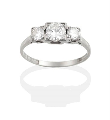 Lot 158 - A Diamond Three Stone Ring, graduated round brilliant cut diamonds in square settings, total...