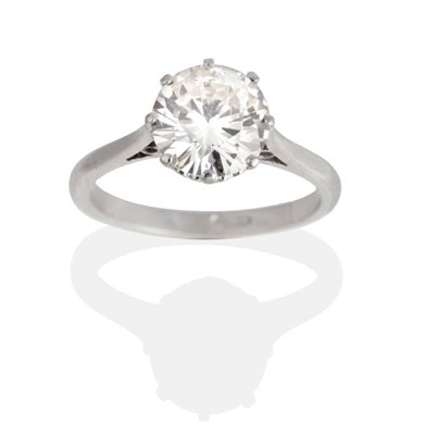 Lot 160 - A Solitaire Diamond Ring, a round brilliant cut diamond in a claw setting, to tapered...