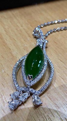 Lot 161 - A Jade and Diamond Pendant, on Chain, a marquise cabochon jade in a claw setting, within a...
