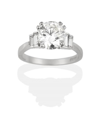 Lot 163 - A Platinum Solitaire Diamond Ring, a round brilliant cut diamond in a double claw setting, to...