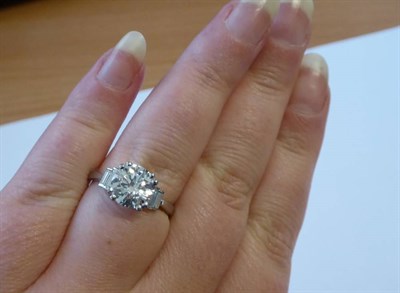 Lot 163 - A Platinum Solitaire Diamond Ring, a round brilliant cut diamond in a double claw setting, to...