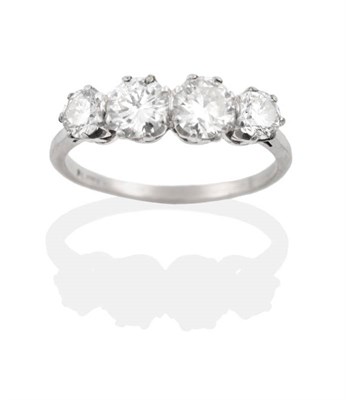 Lot 165 - A Diamond Four Stone Ring, graduated round brilliant cut diamonds in claw settings, to tapering...