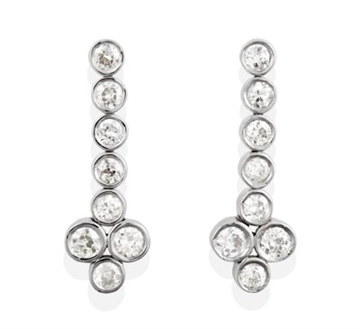 Lot 166 - A Pair of Diamond Pendant Earrings, a row of old cut diamonds in rubbed over settings...