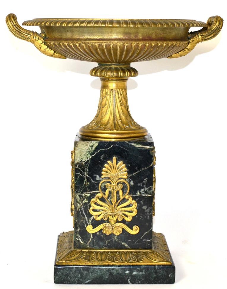 Lot 273 - A Gilt Bronze Tazza, in Empire style, with gadrooned borders and fluted handles, on a circular...