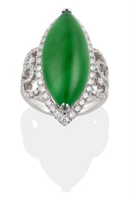 Lot 167 - A Jade and Diamond Cluster Ring, a marquise cabochon jade in a claw setting, within a border of...