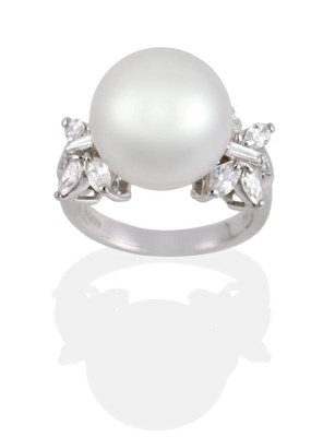 Lot 178 - A South Sea Pearl and Diamond Ring, a central pearl to marquise and tapered baguette cut...