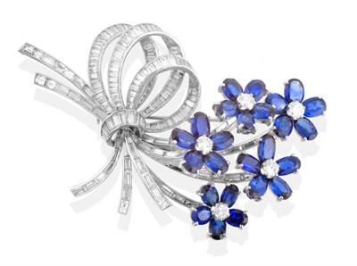 Lot 182 - A Sapphire and Diamond Spray Brooch, flower heads each with a central round brilliant cut...