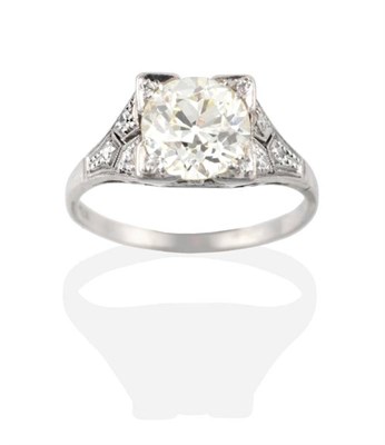 Lot 195 - An Art Deco Solitaire Diamond Ring, an old cut diamond in a square setting, to tapering and pierced