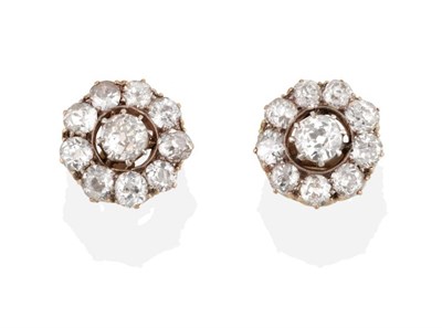 Lot 204 - A Pair of Circa 1900s Diamond Cluster Earrings, old cut diamonds in claw settings within halo...