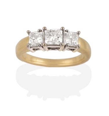 Lot 206 - A Princess Cut Diamond Three Stone Ring, graduated princess cut diamonds in claw settings, to...