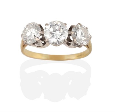 Lot 207 - An 18 Carat Gold Diamond Three Stone Ring, graduated round brilliant cut diamonds in claw settings
